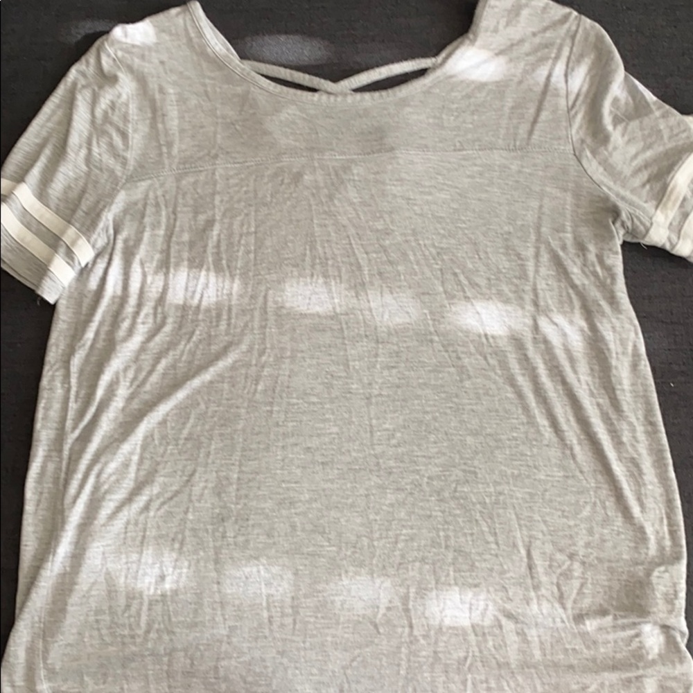 Grey top, with top of the back open